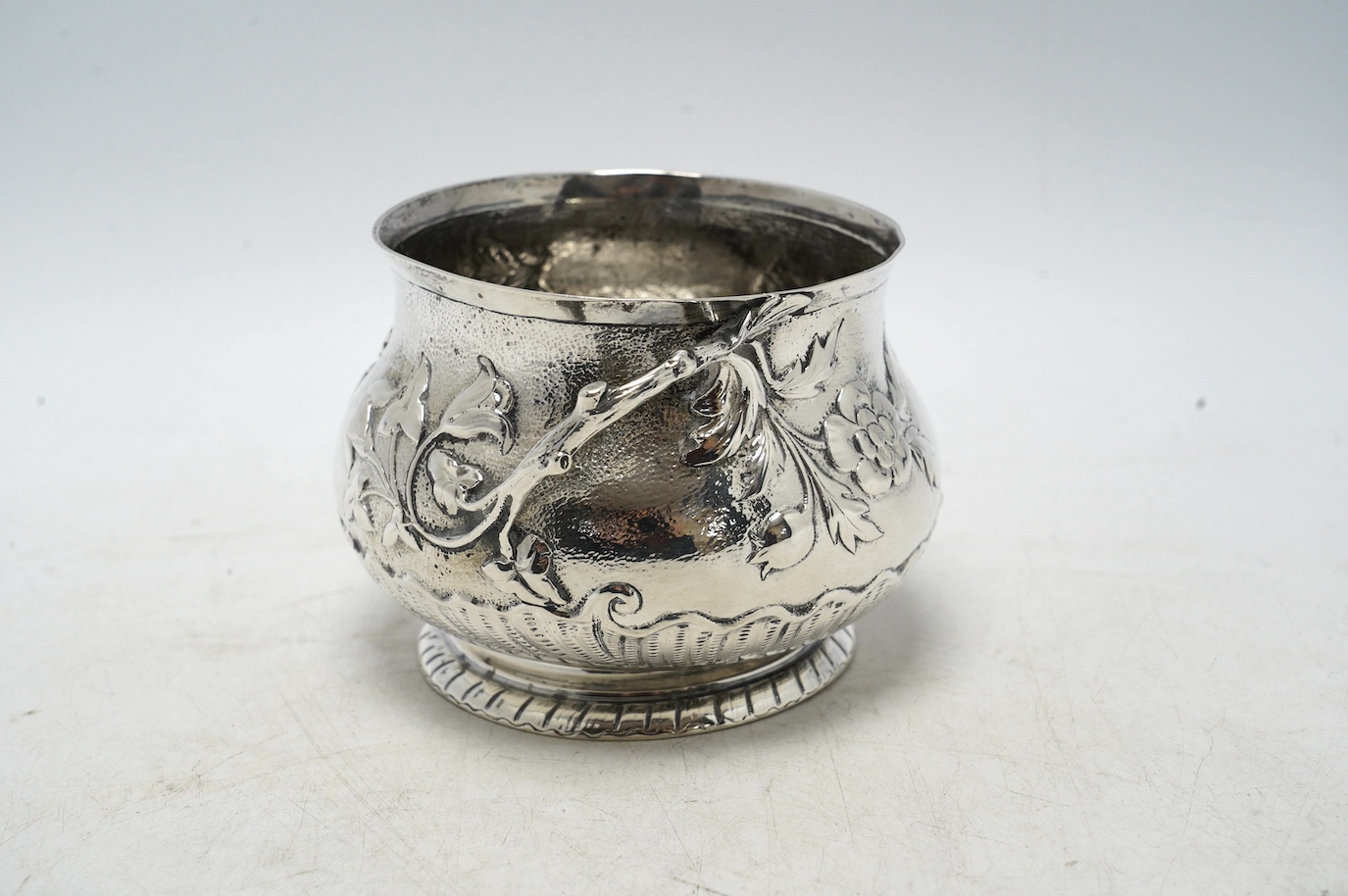 A late Victorian silver two handled sugar bowl, by Carrington & Co, London 1900, 7.3oz. Condition - poor to fair